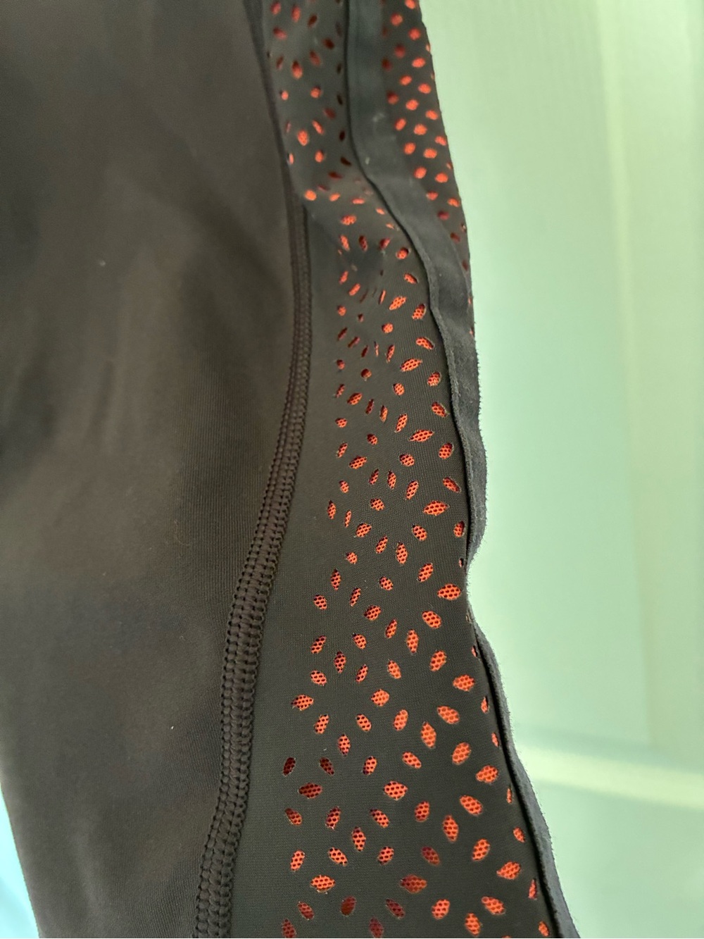 lululemon athletica Black Cropped Leggings with Red Accent Laser Cut Panels - Picture 2 of 4